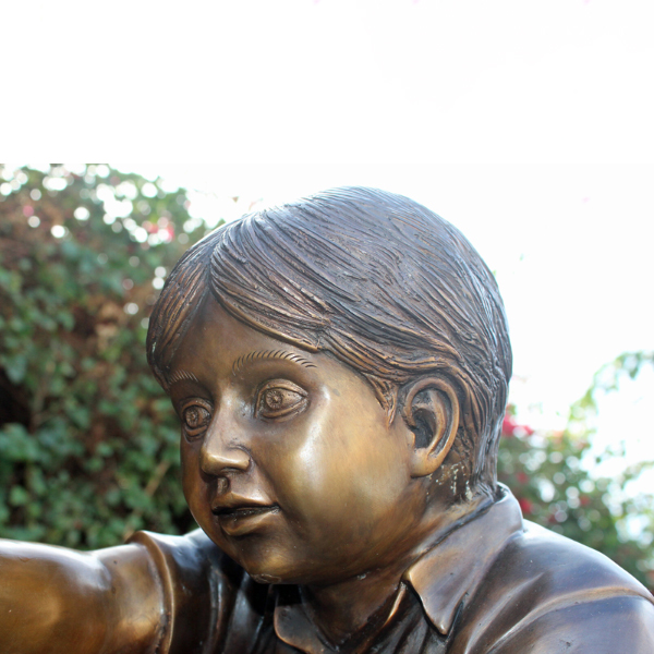 Bronze Boy and Puppy Statue Face Detail