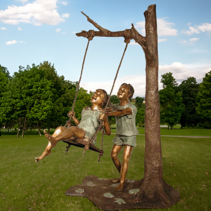 Bronze Children on Swing Statue in Park