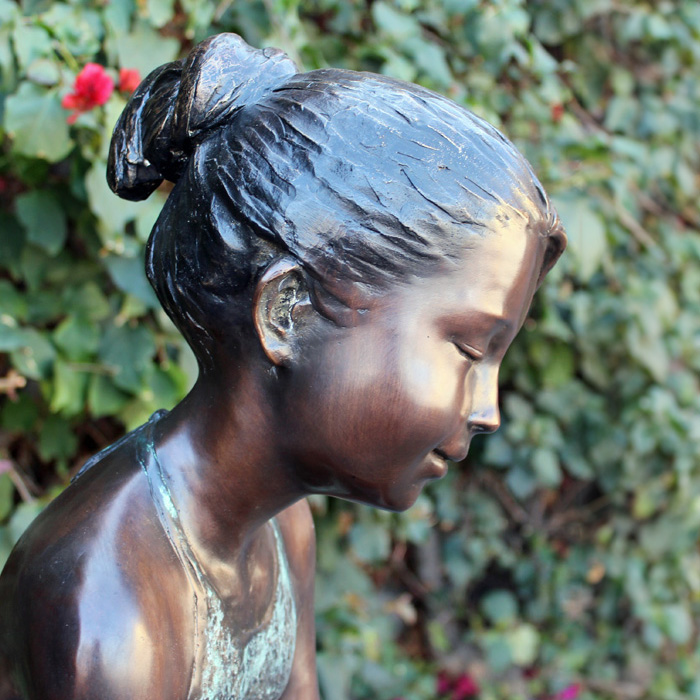 Bronze Sitting Girl outdoor Sculpture close-up view