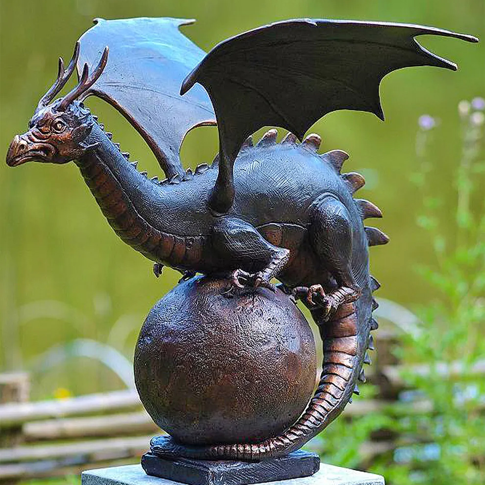 Bronze dragon sculpture guarding round orb