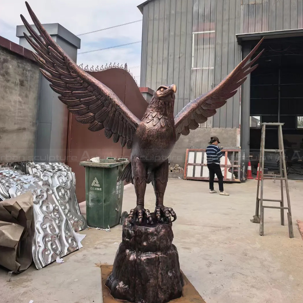 Large Bronze Eagle Spreading Wings Outdoors