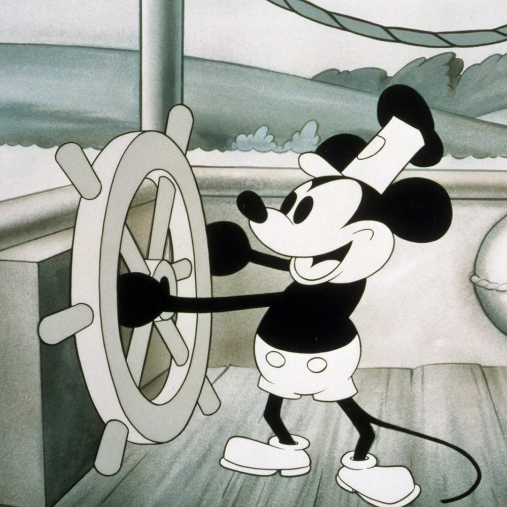 Mickey steering the wheel in Steamboat Willie