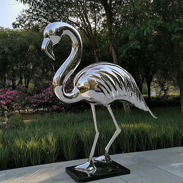 Mirror polished Metal Flamingo Statue outdoors