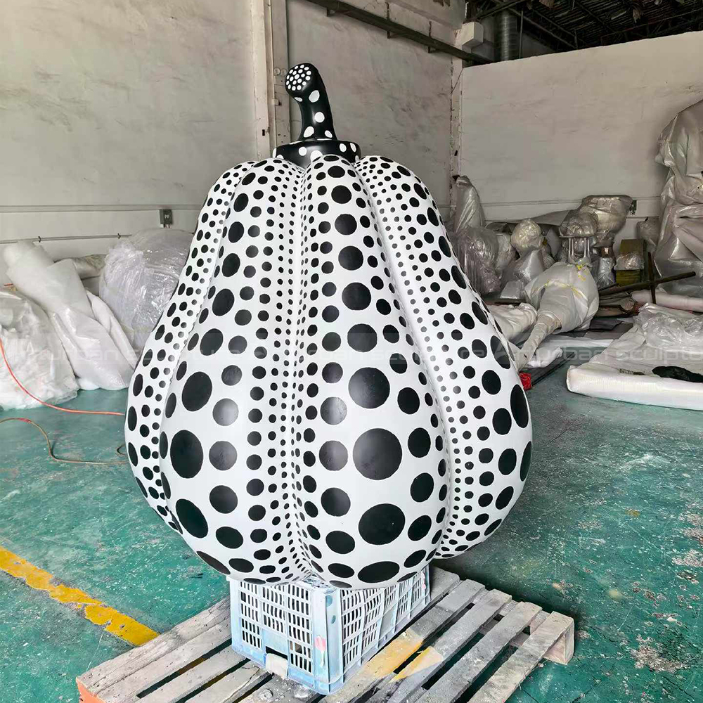 White outdoor pumpkin statue fiberglasss black dots