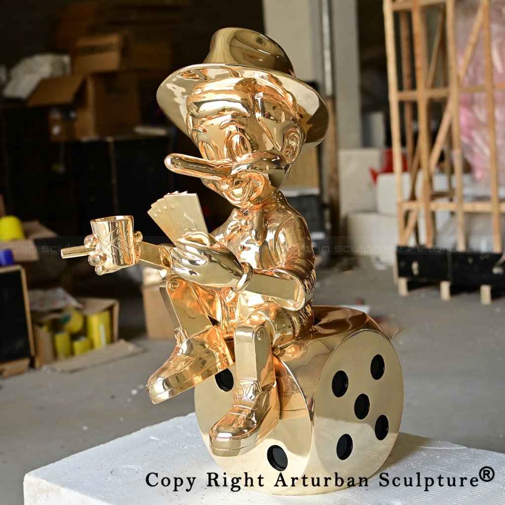 0 brass pinocchio statue holding cards and cup