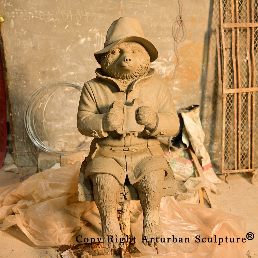 4 Front clay model holding sandwich with both paws