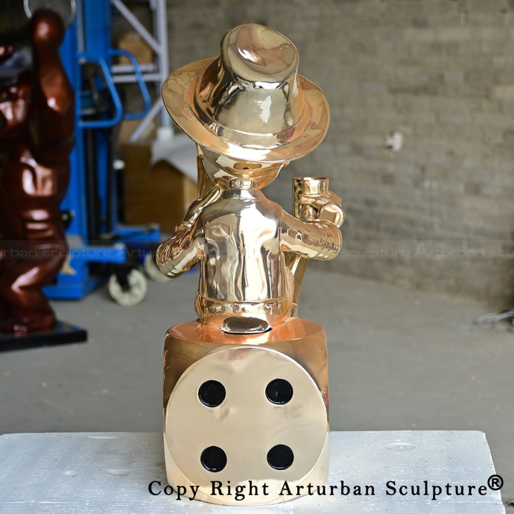 4 Rear brass pinocchio statue showing dice base details