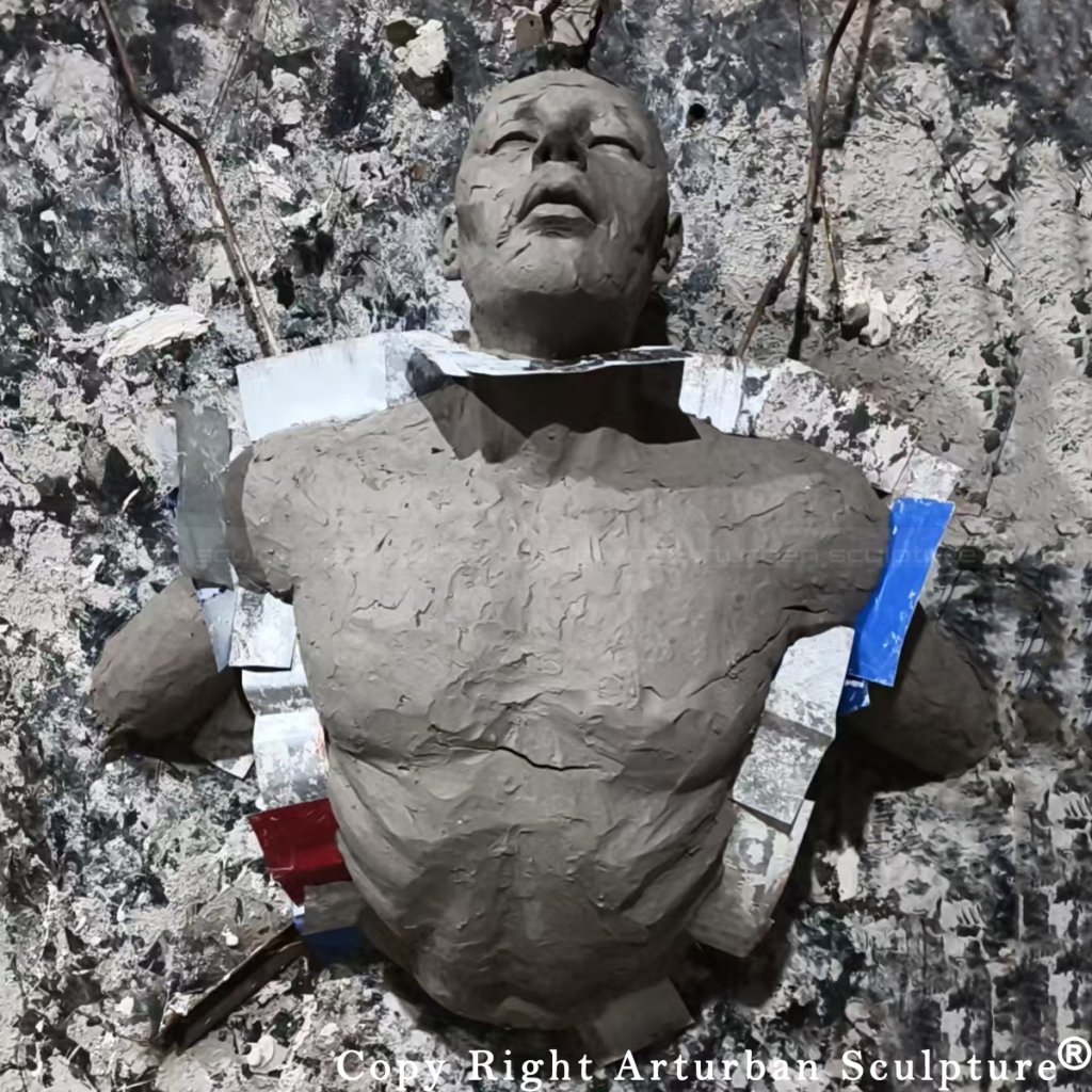 5 Clay model for man breaking through wall sculpture