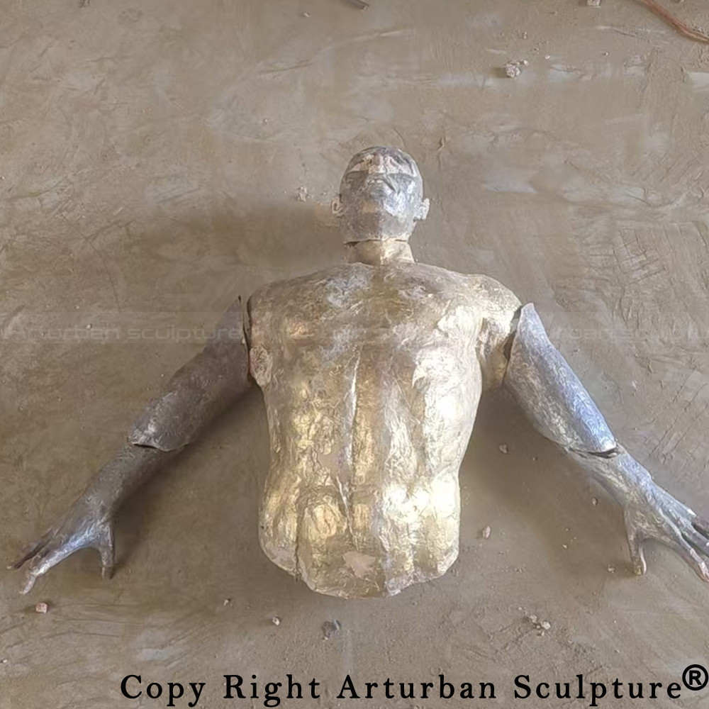5 Raw man breaking through wall sculpture casting
