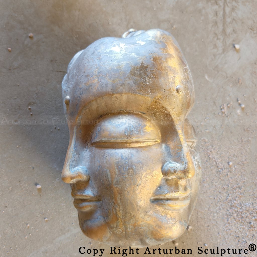 5 faced buddha head before bronze grinding