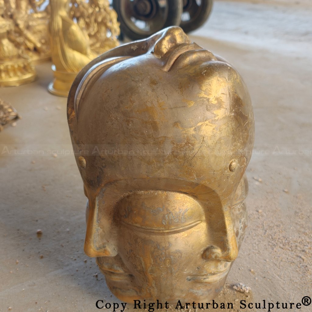 Raw bronze Buddha head before surface finishing