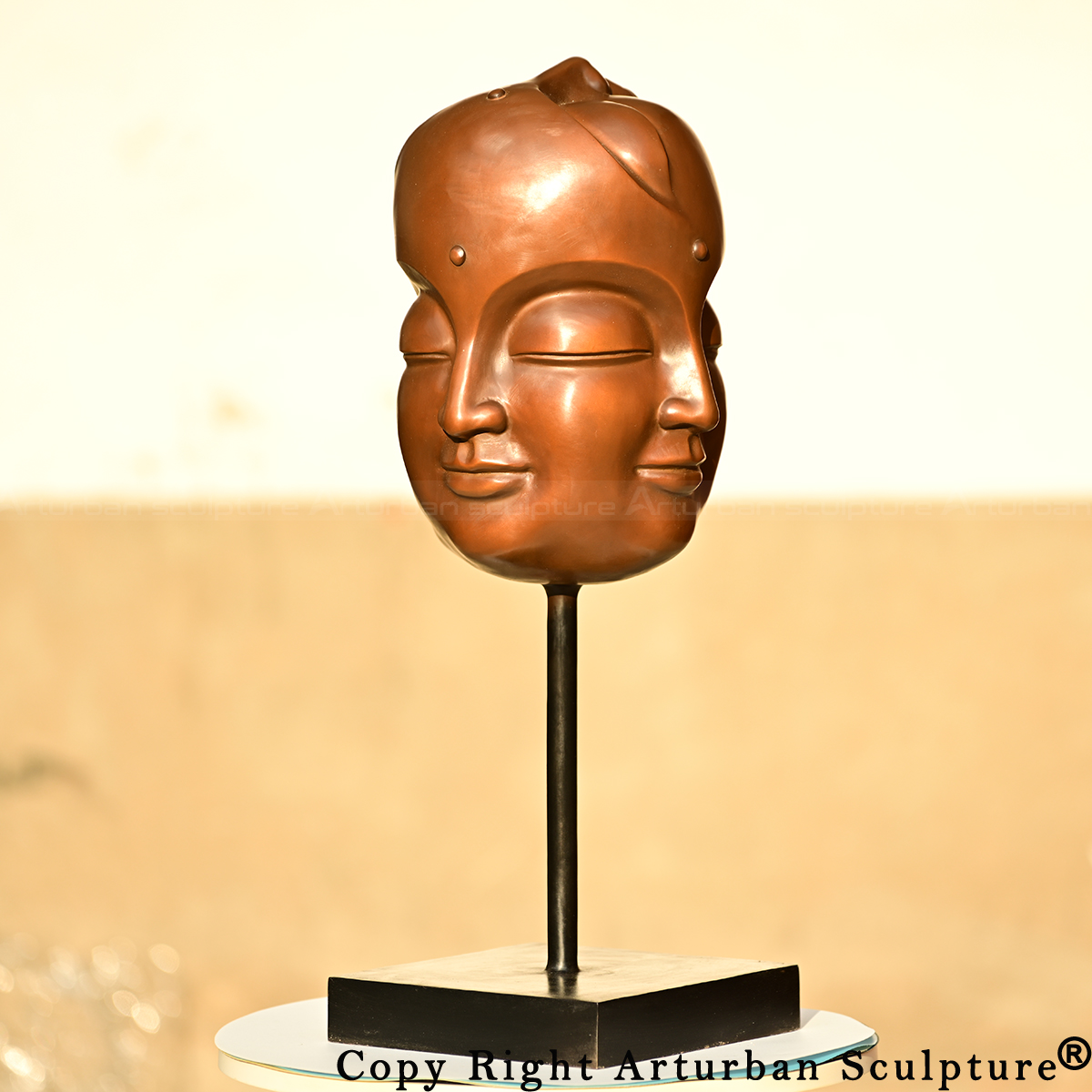 Bronze 5 faced buddha head side view