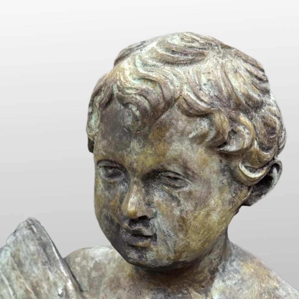 Bronze Putti Statue face closeup detail