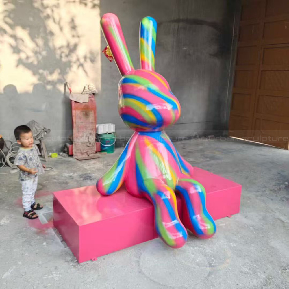 Colorful Rabbit Sculpture with fiberglass rainbow stripes