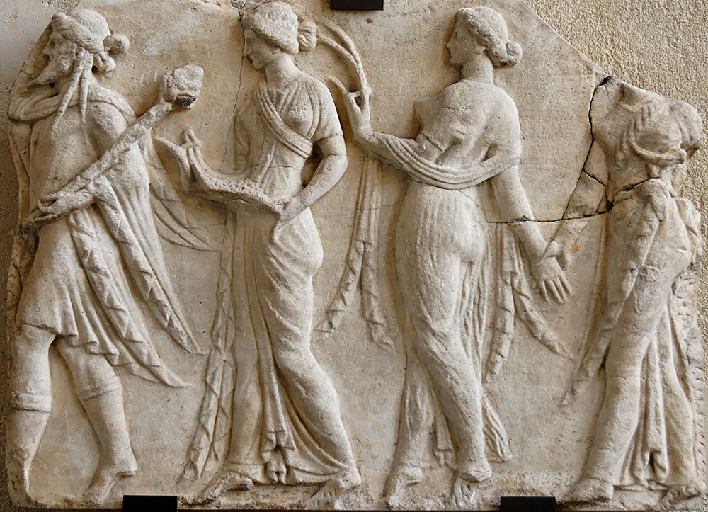 Dionysus leading the Horae in marble relief