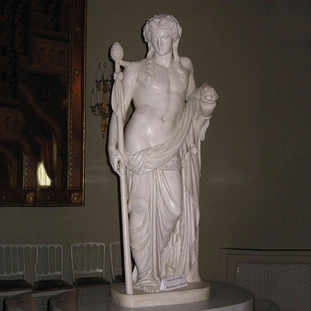 Dionysus marble statue holding thyrsus