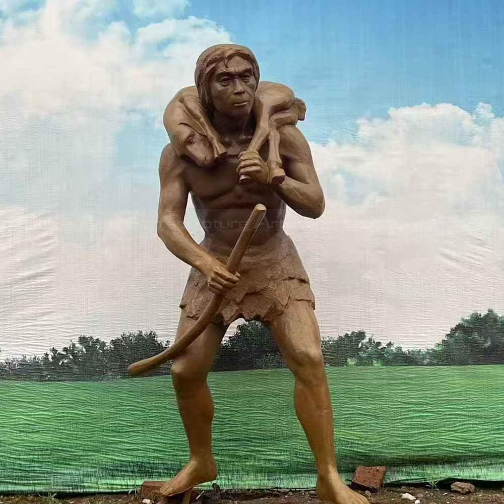 Fiberglass Caveman Sculpture carrying hunted animal home