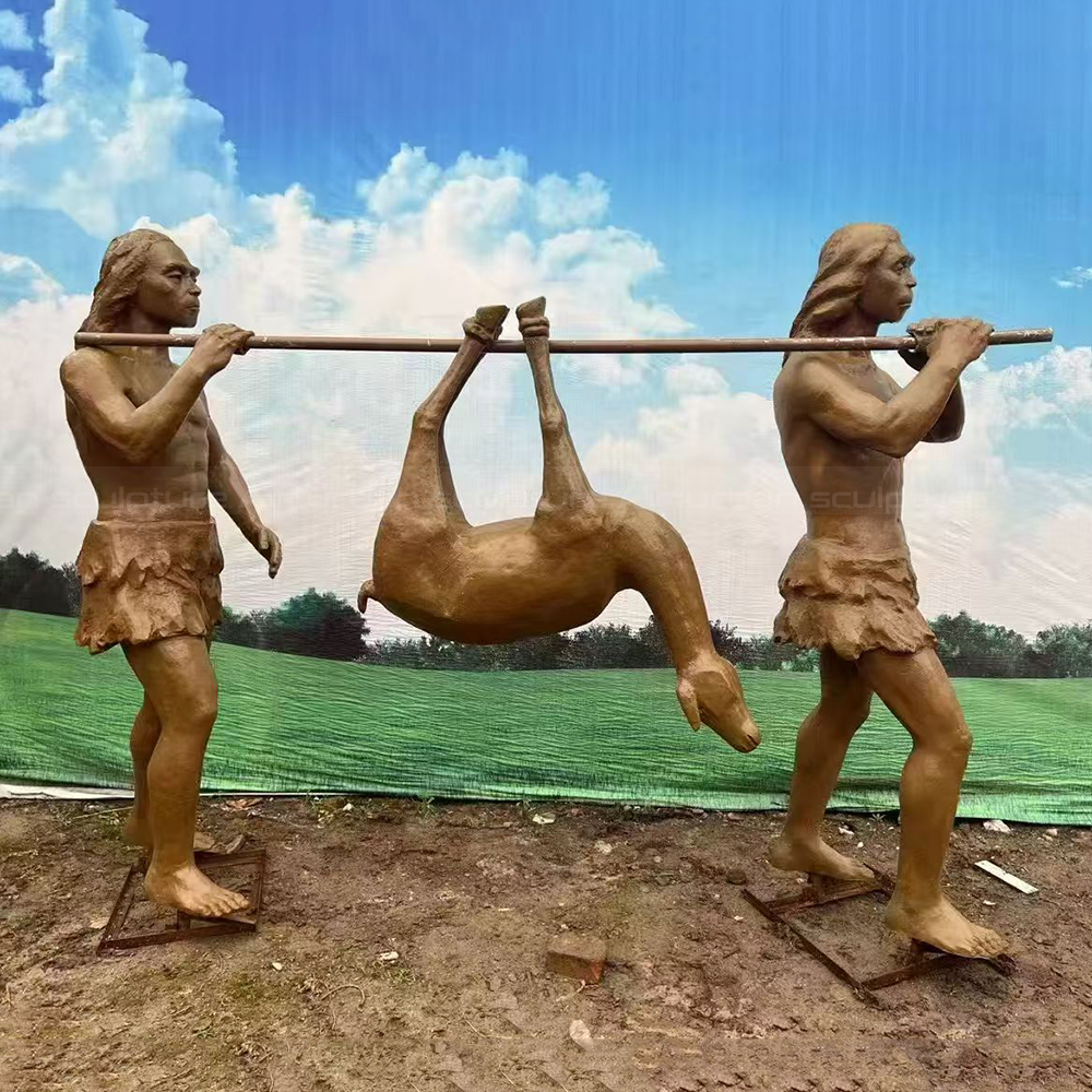 Fiberglass Caveman Sculpture carrying hunted deer together
