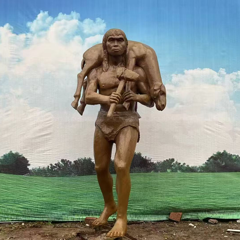 Fiberglass Caveman Sculpture carrying prey on shoulders
