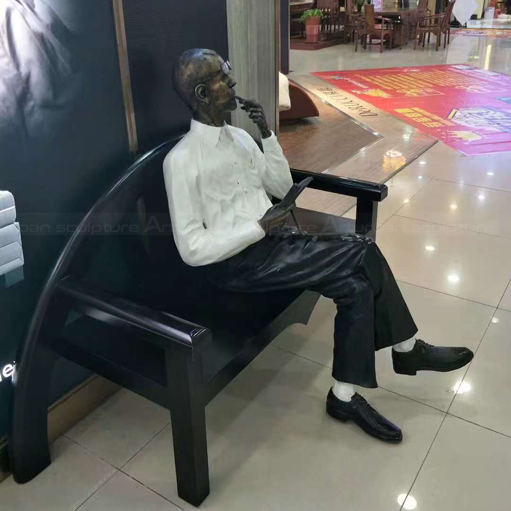 Fiberglass Reading Man Statue holding reading material
