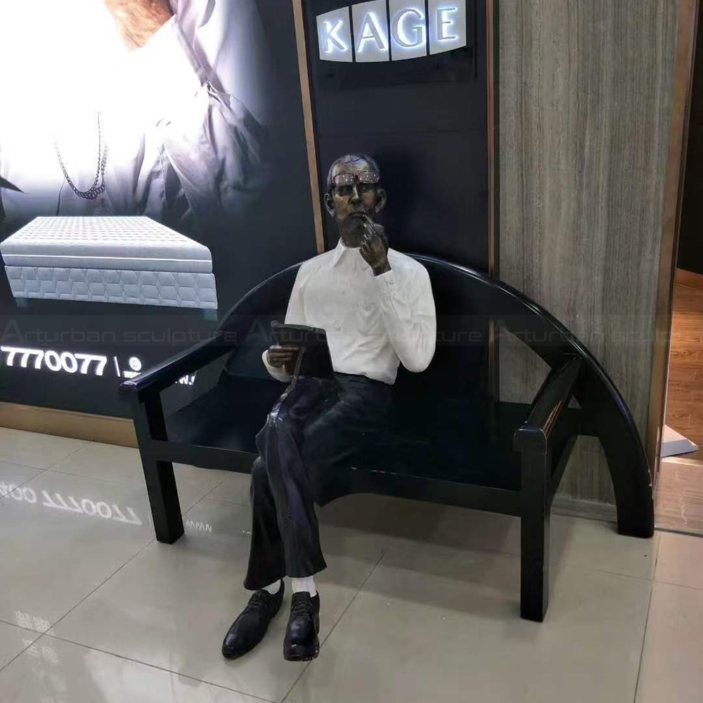 Fiberglass Reading Man Statue seated on bench