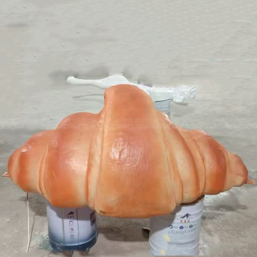 Fiberglass croissant statue with layered pastry form