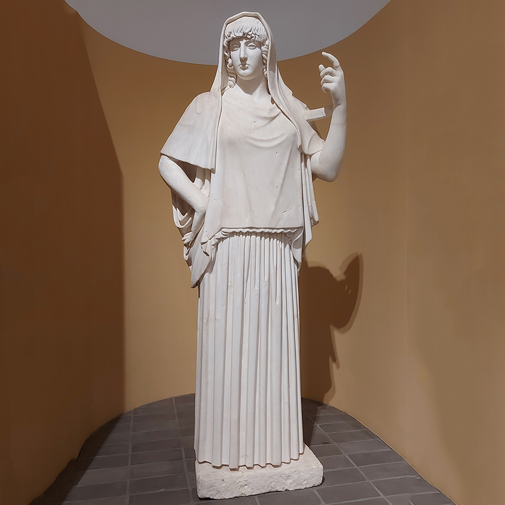 Hestia marble statue holding a torch