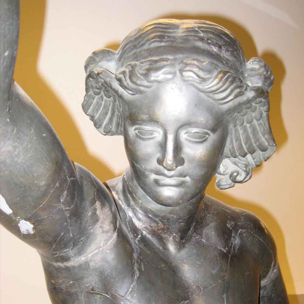 Hypnos statue with wings beside head