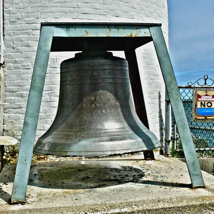 Large antique outdoor bell on metal frame