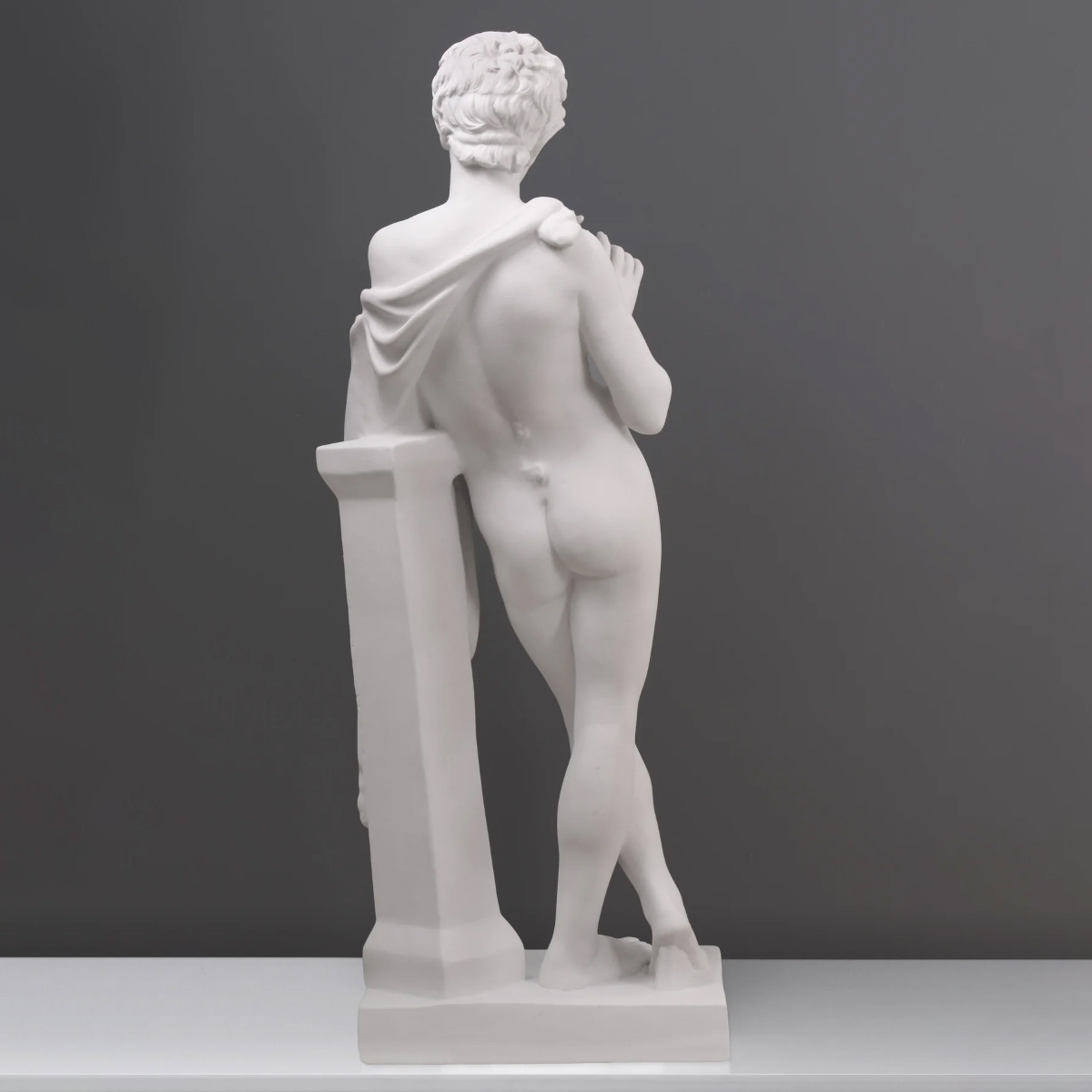 Marble Satyr statue beside column