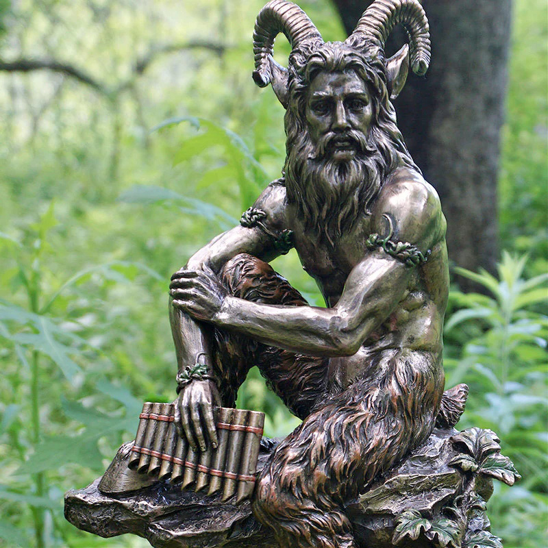 Pan bronze statue with horns and panpipes