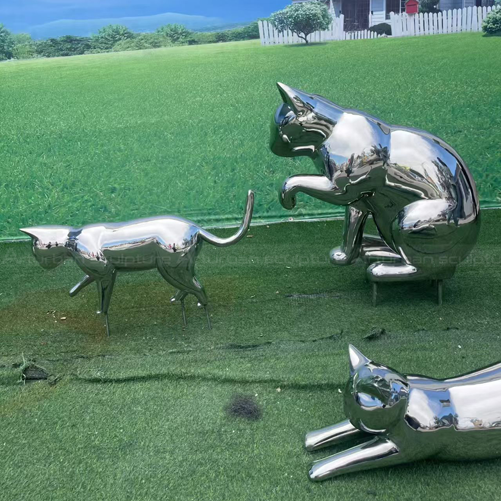 Stainless steel cat yard statue group outdoors