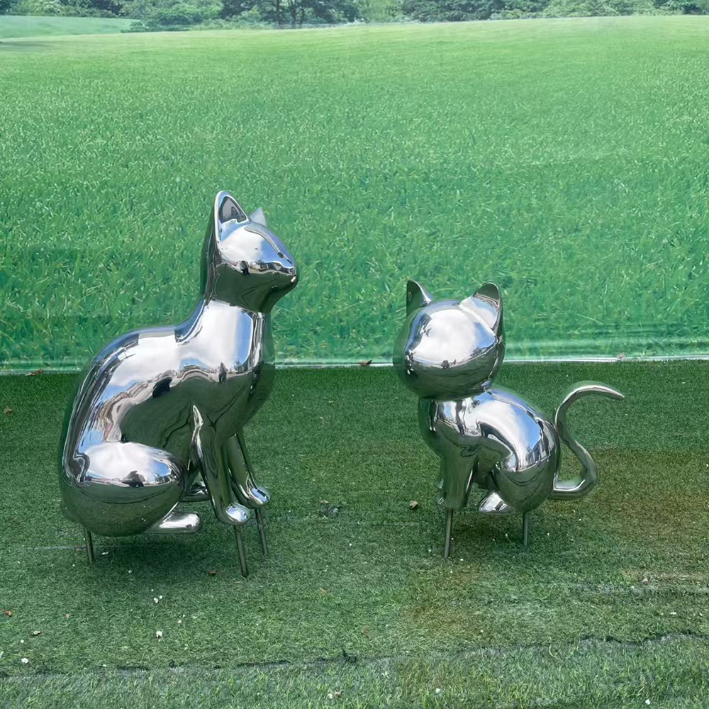 Two stainless steel cat yard statue designs