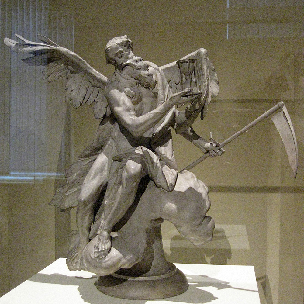 Winged Chronos statue holding scythe and hourglass