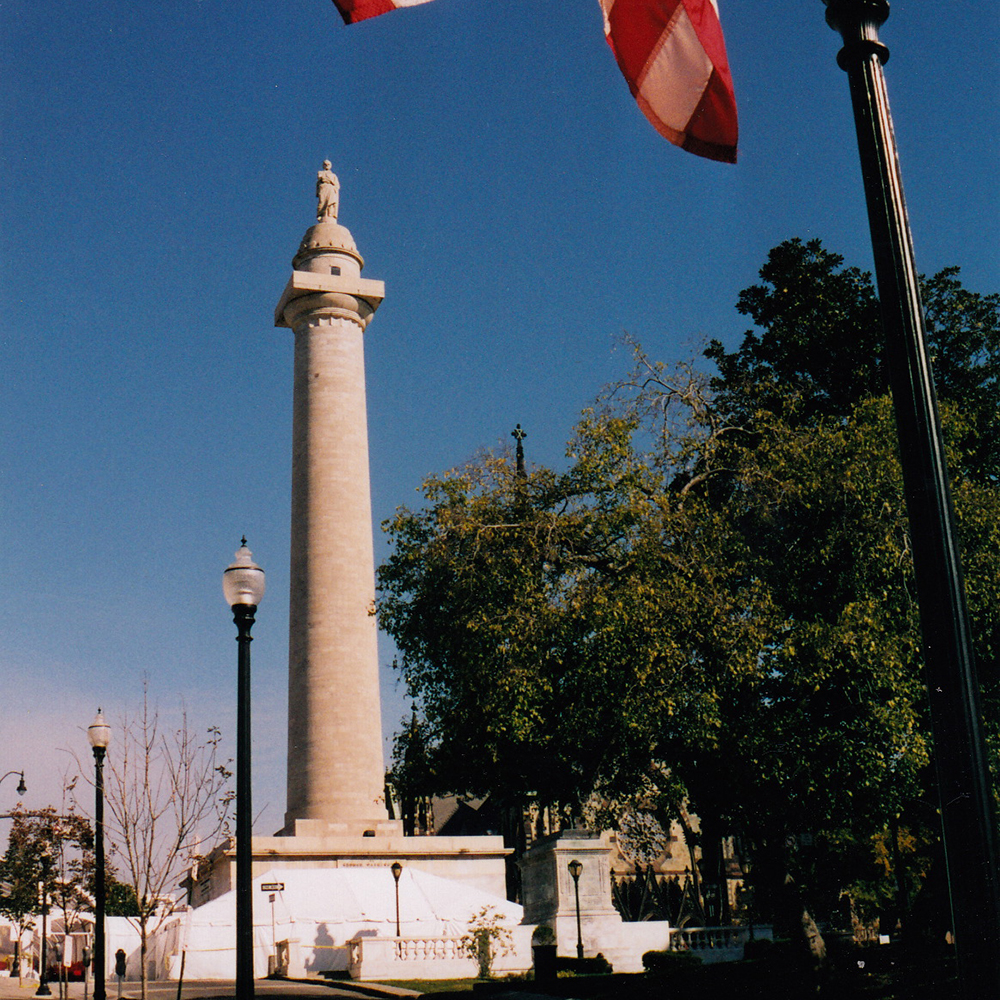 Baltimore Washington Monument beneath American flag