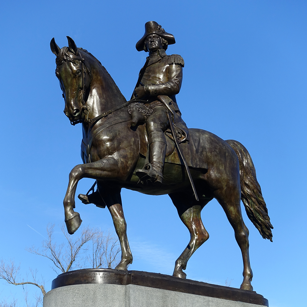 Boston bronze equestrian Washington against blue sky