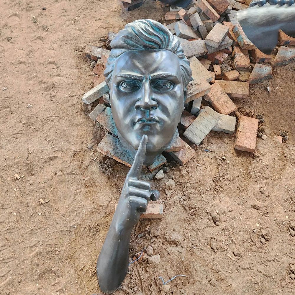 Bronze Man Wall Statue making quiet gesture