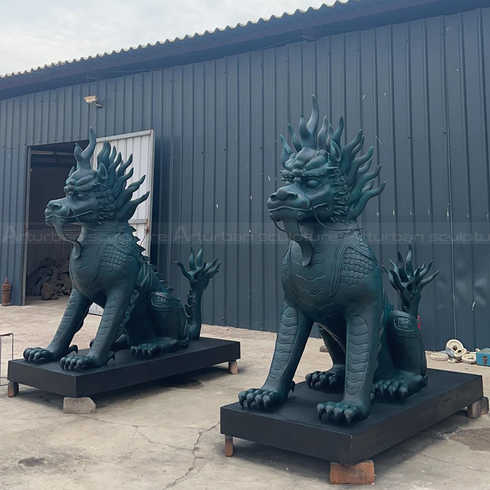 Bronze Qi Lin Statue pair seated outdoors