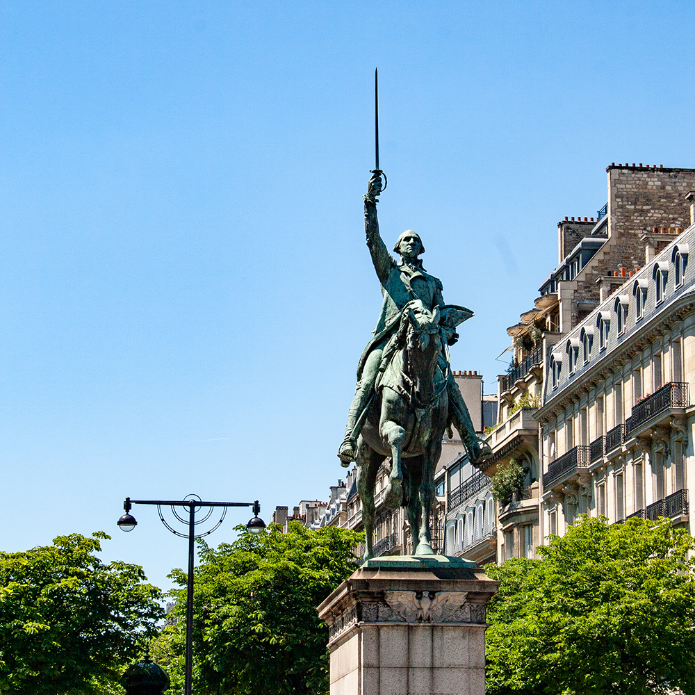 Bronze Washington equestrian monument against Paris architecture