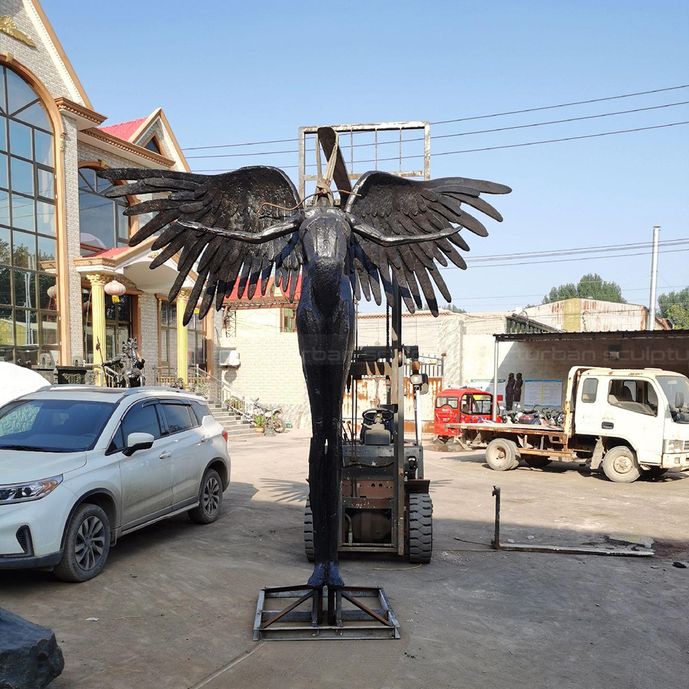 Bronze Winged Figure Sculpture with outstretched feathered wings