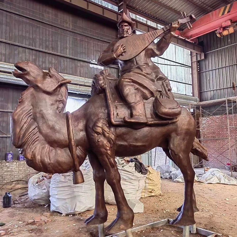 Bronze large camel statue with mounted musician