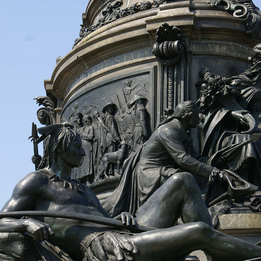 Bronze relief and Native American monument figures