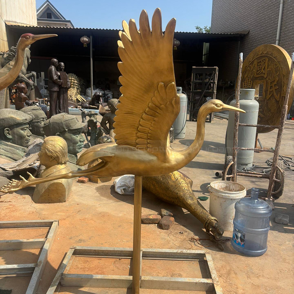 Crane Yard Statue bronze side flying view