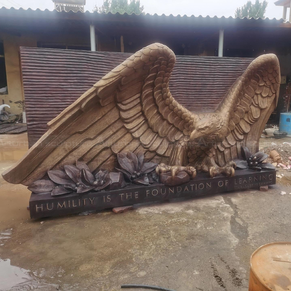 Eagle Big Statue bronze memorial with flowers