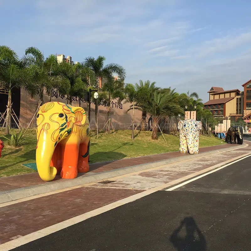 Fiberglass Colorful Elephant Sculpture along landscaped walkway