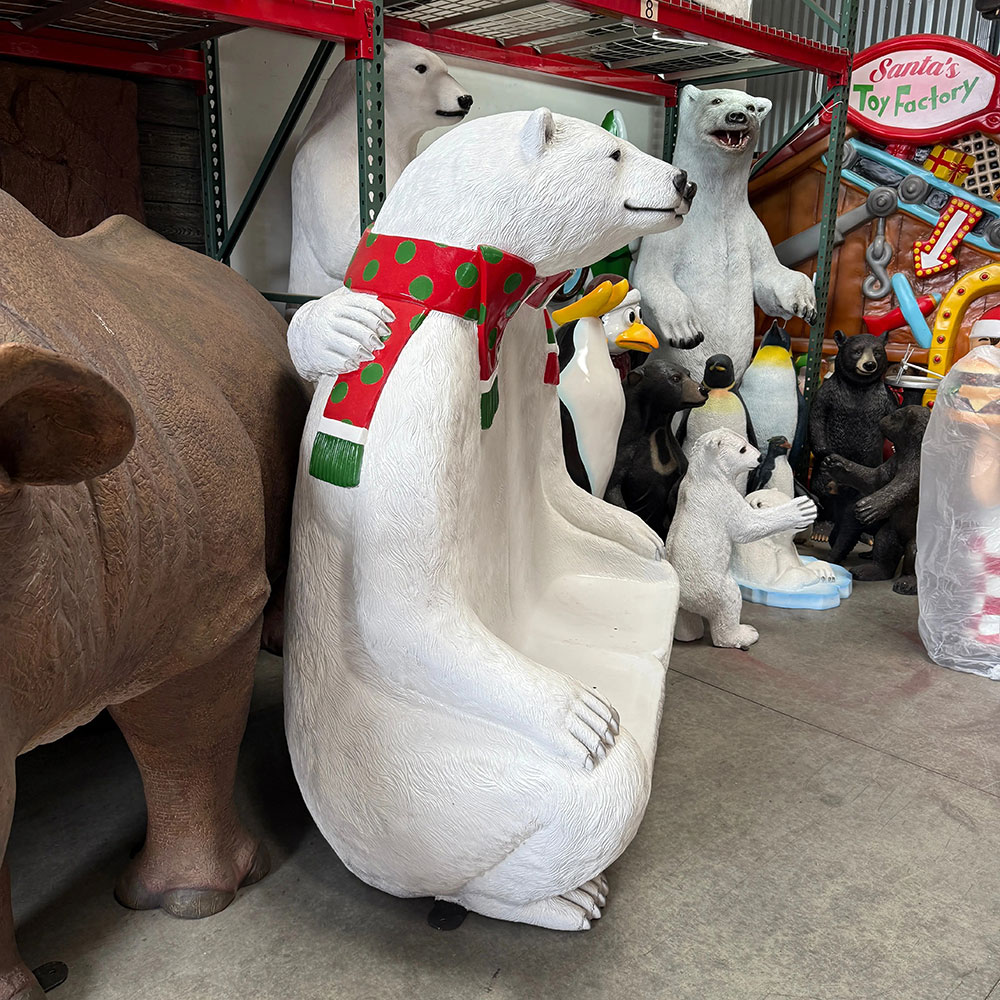 Fiberglass Polar Bear Bench with festive scarf