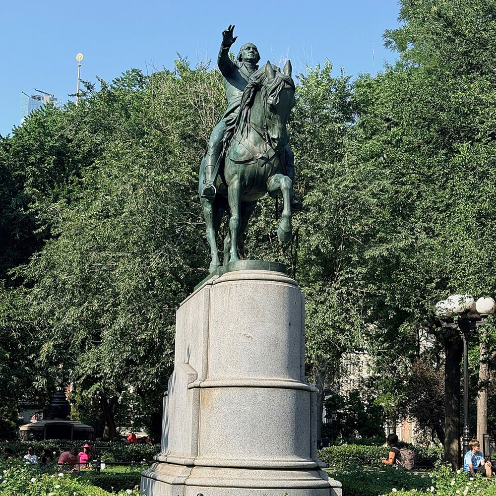 Bronze George Washington statue raising hand on horseback