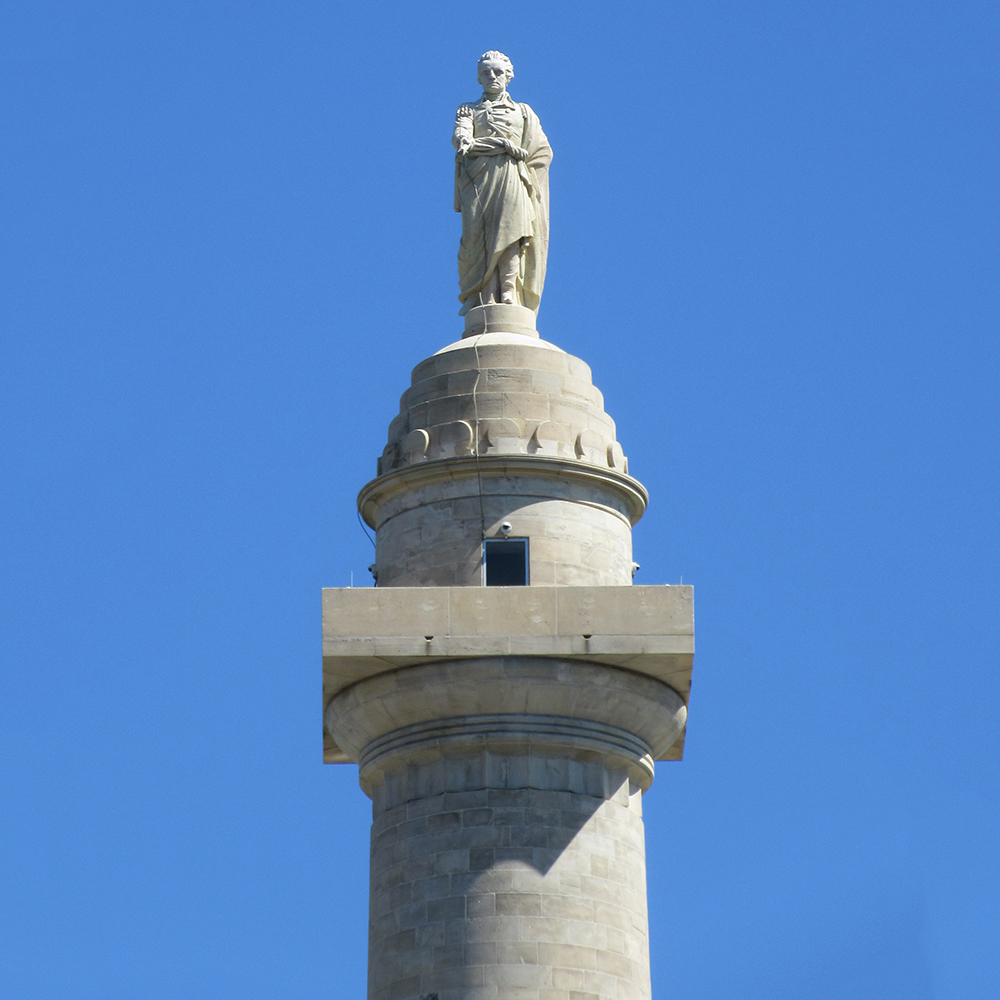 George Washington statue atop monumental marble column