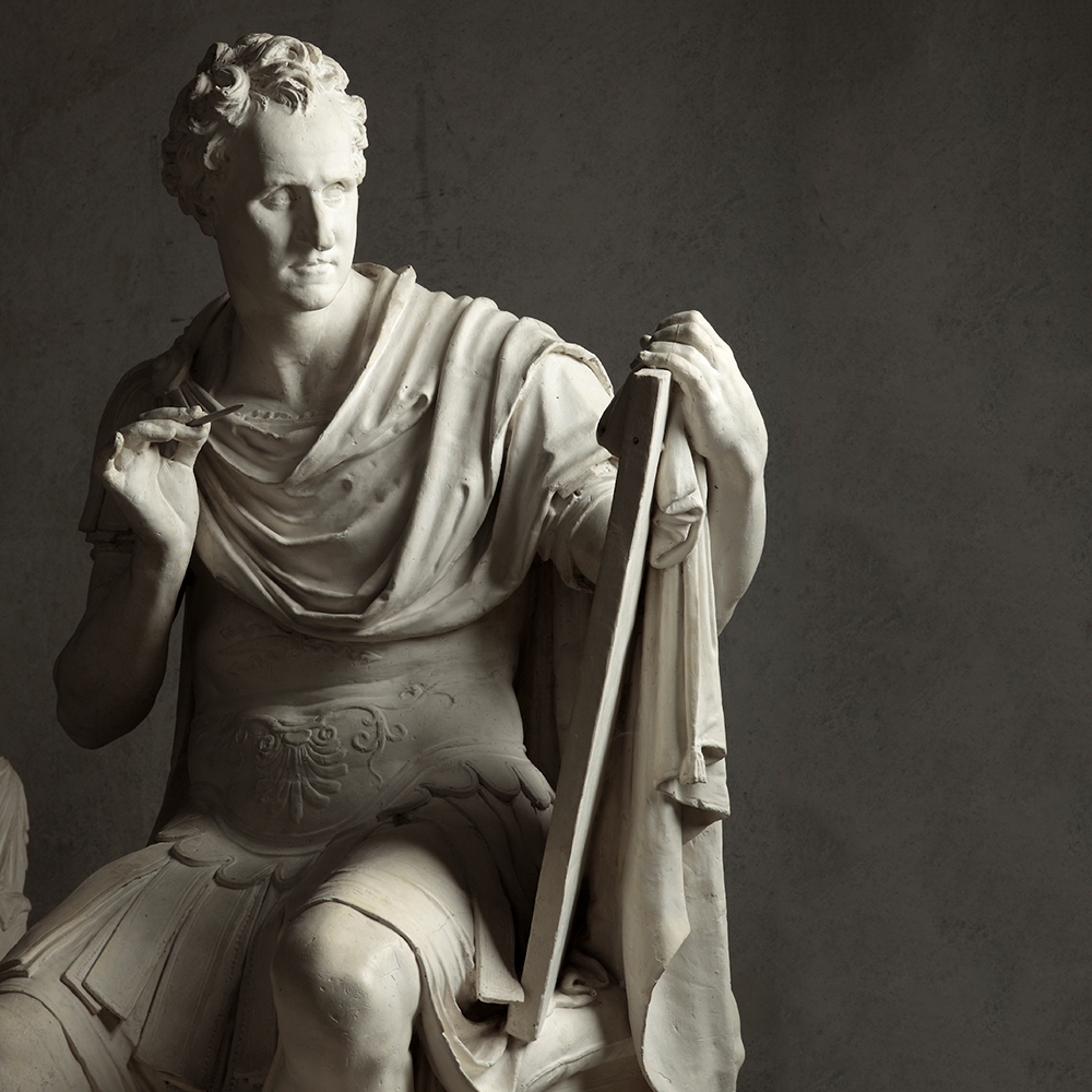 George Washington statue detail with writing tablet