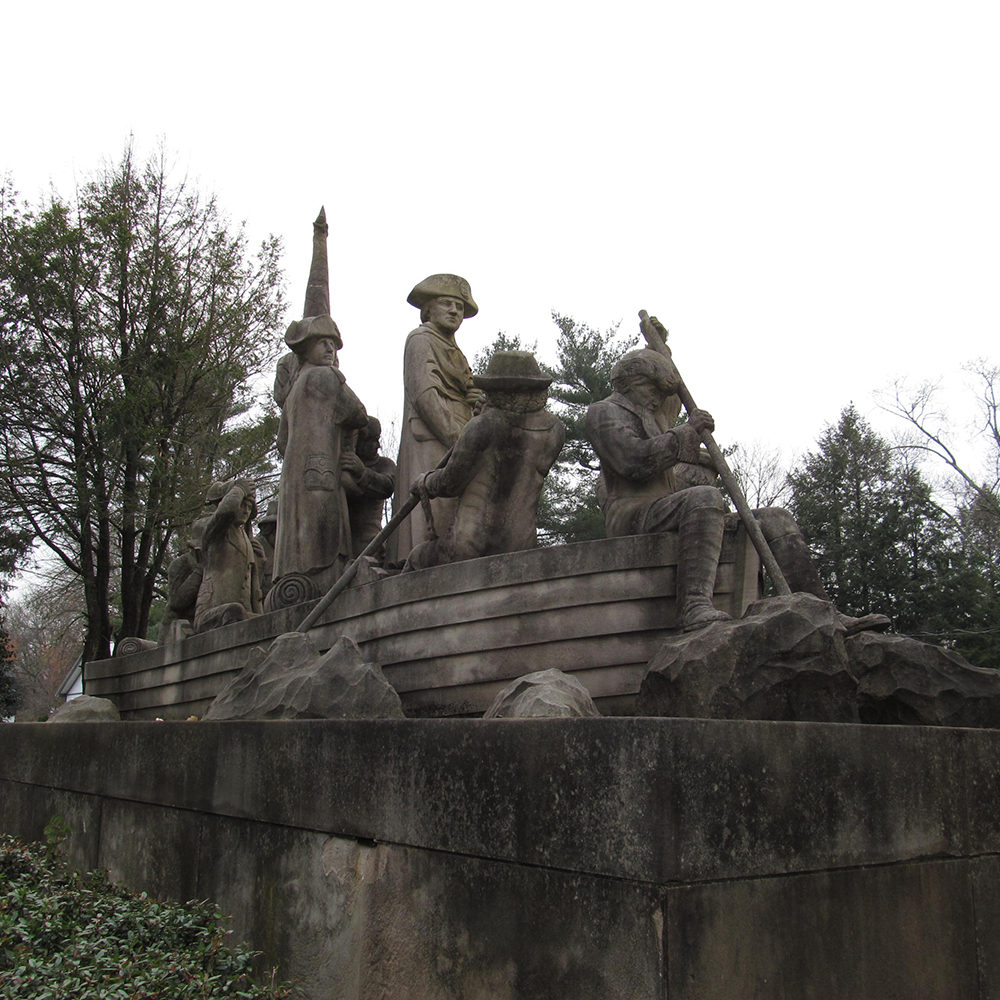 Historic limestone Delaware crossing monument side view